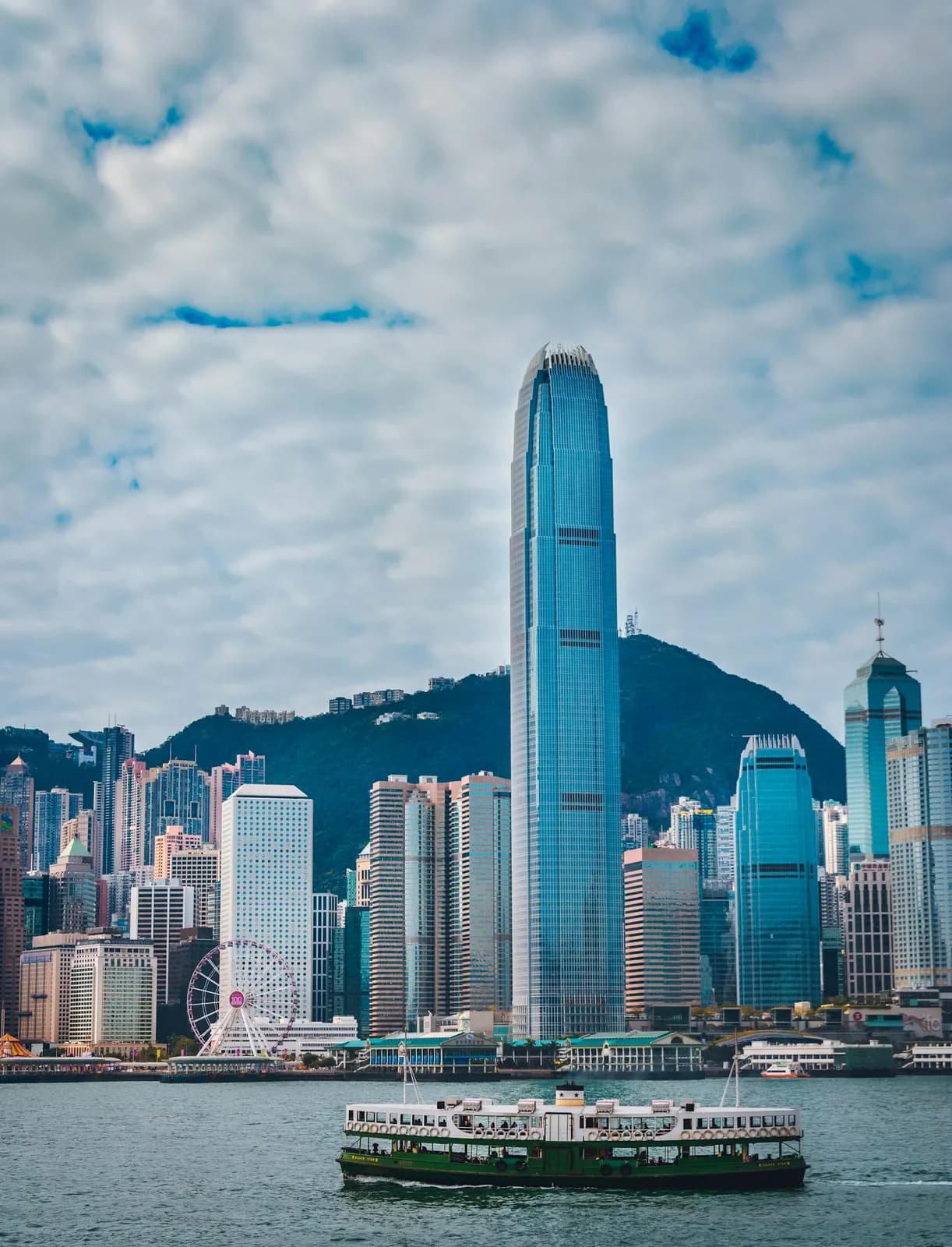 A Star Ferry crossing Victoria Harbour below the Hong Kong skyline