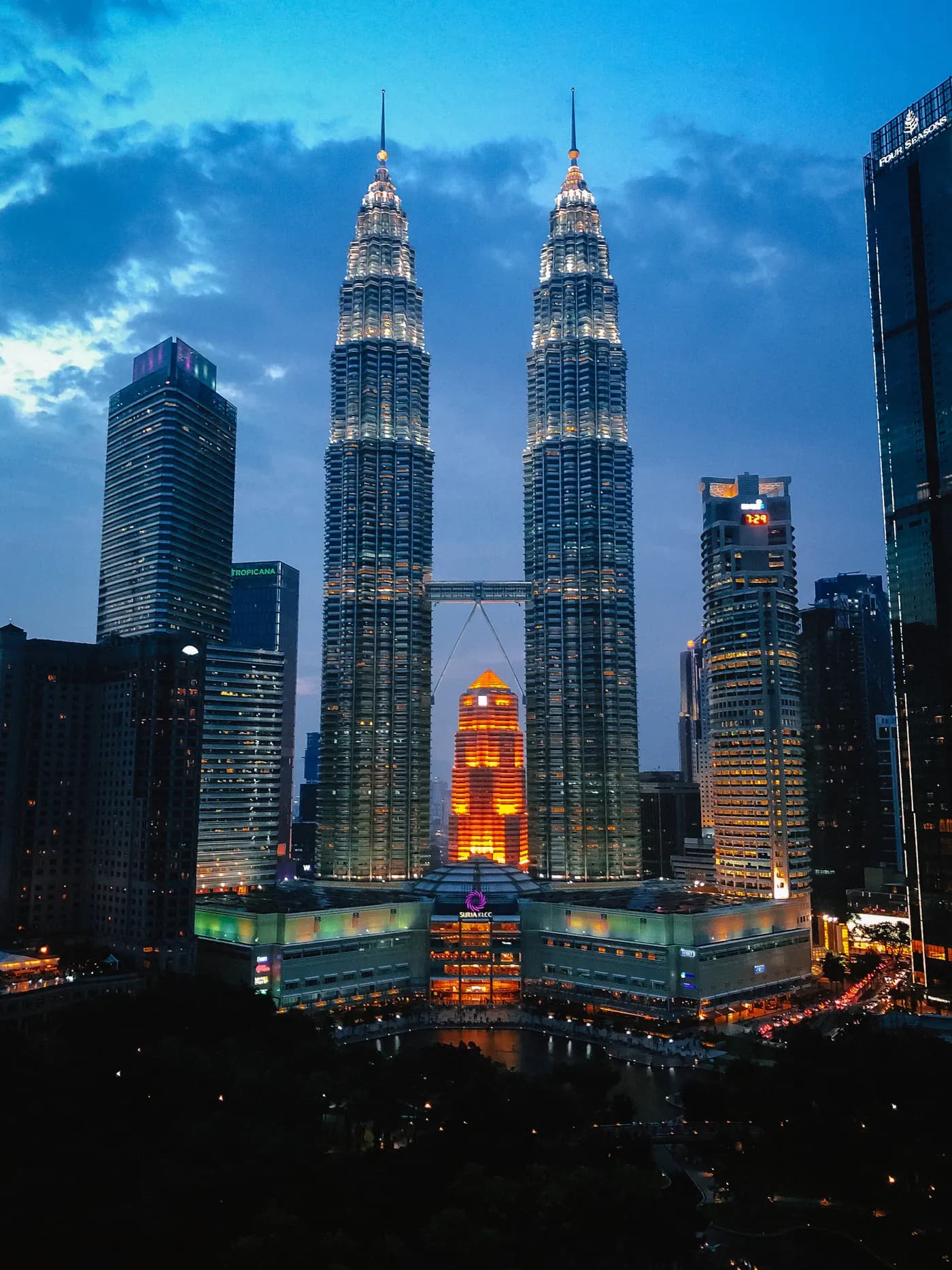 The Petronas Twin Towers lit up at dusk, Kuala Lumpur