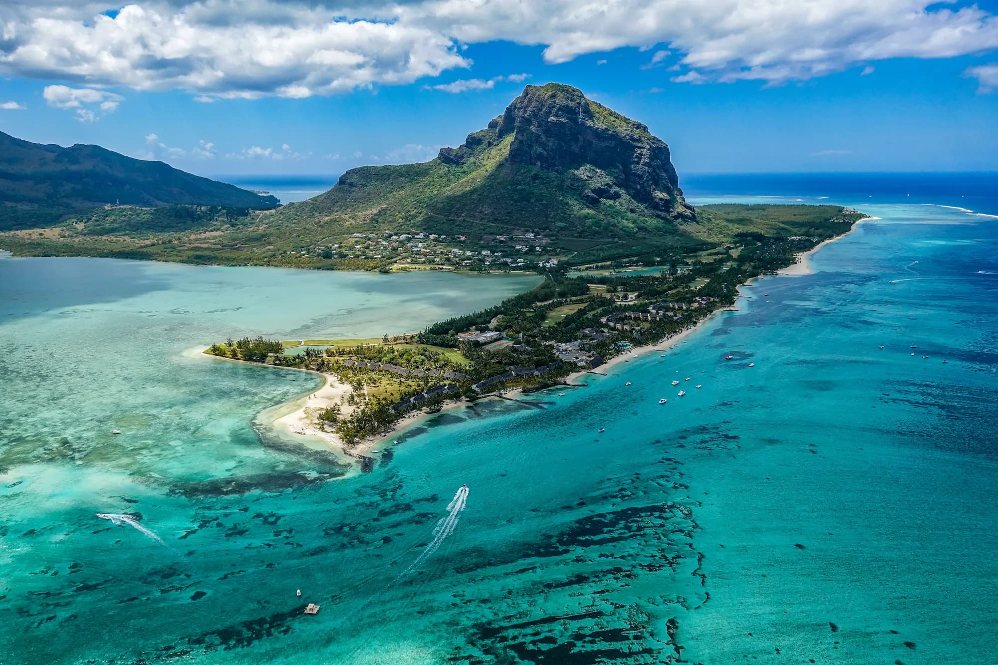 Le Morne and the reef's “underwater waterfall” from above