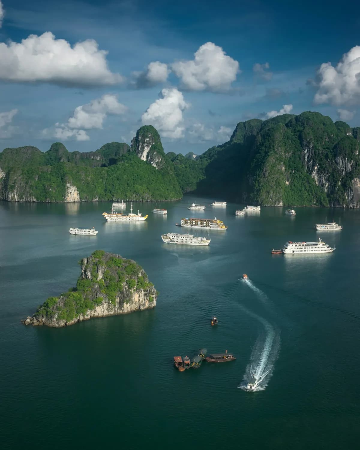 Boats among the limestone islands of Ha Long Bay