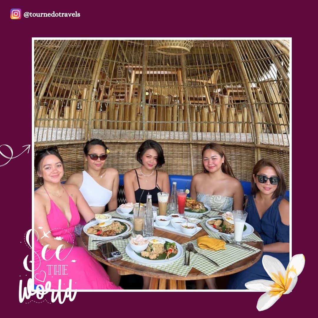 Five friends at lunch under a bamboo dome, Bali