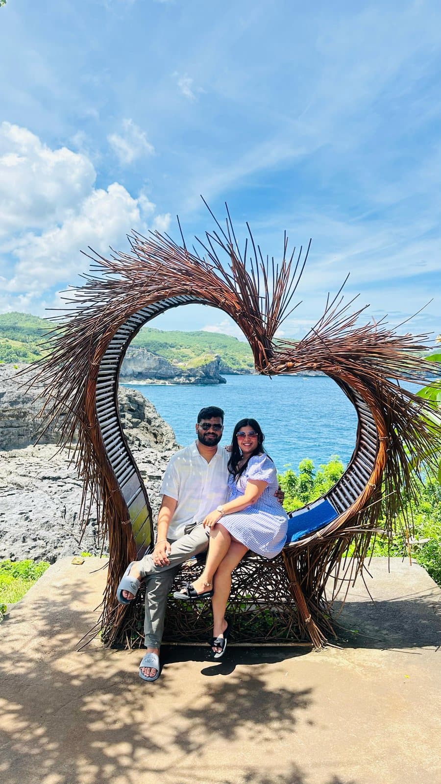 A couple in a heart-shaped nest above the sea, Nusa Penida, Bali
