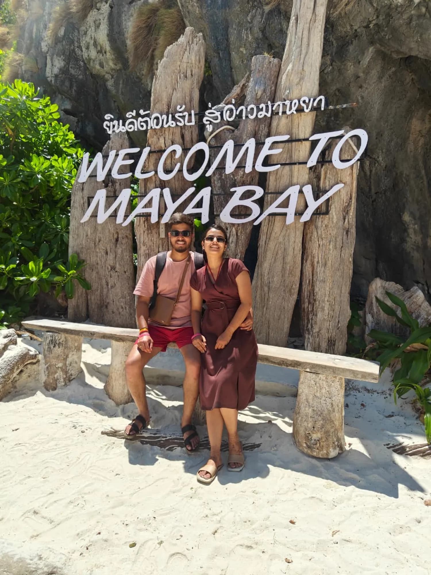 A couple at the Welcome to Maya Bay sign, Thailand