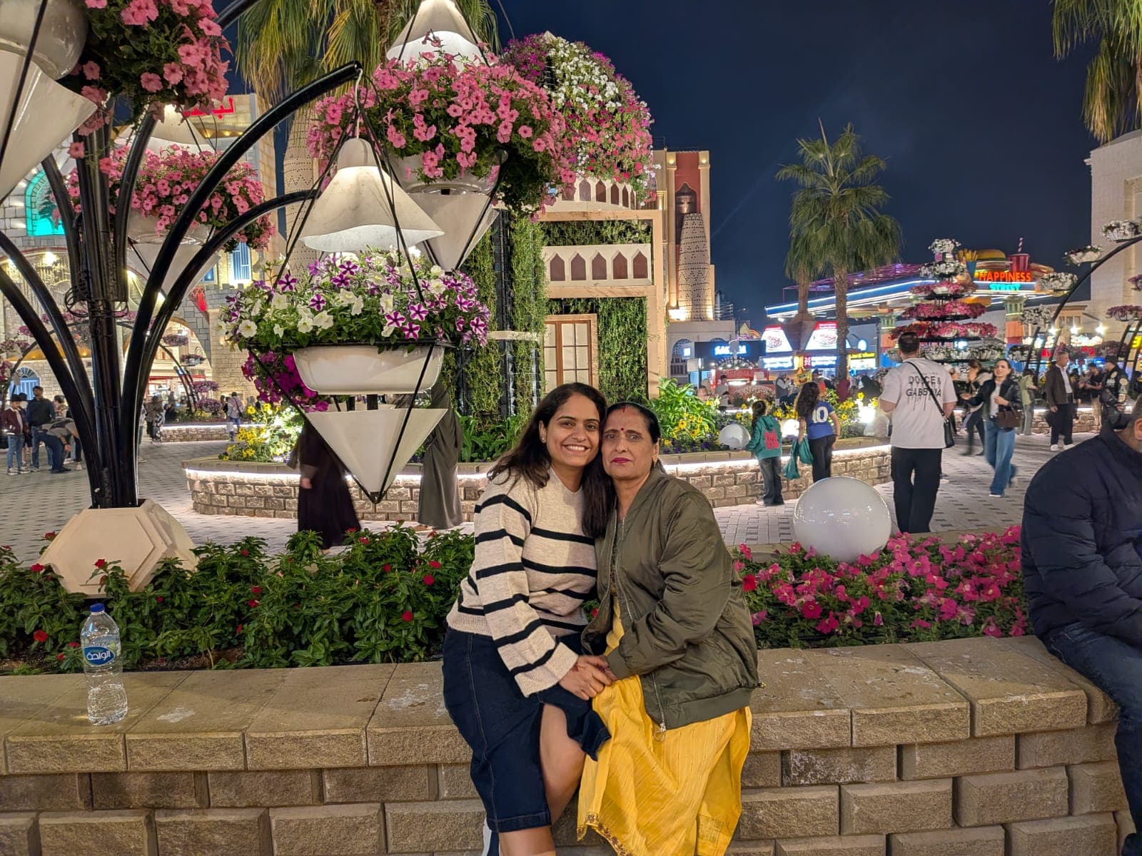 A mother and daughter among flower lanterns in Dubai