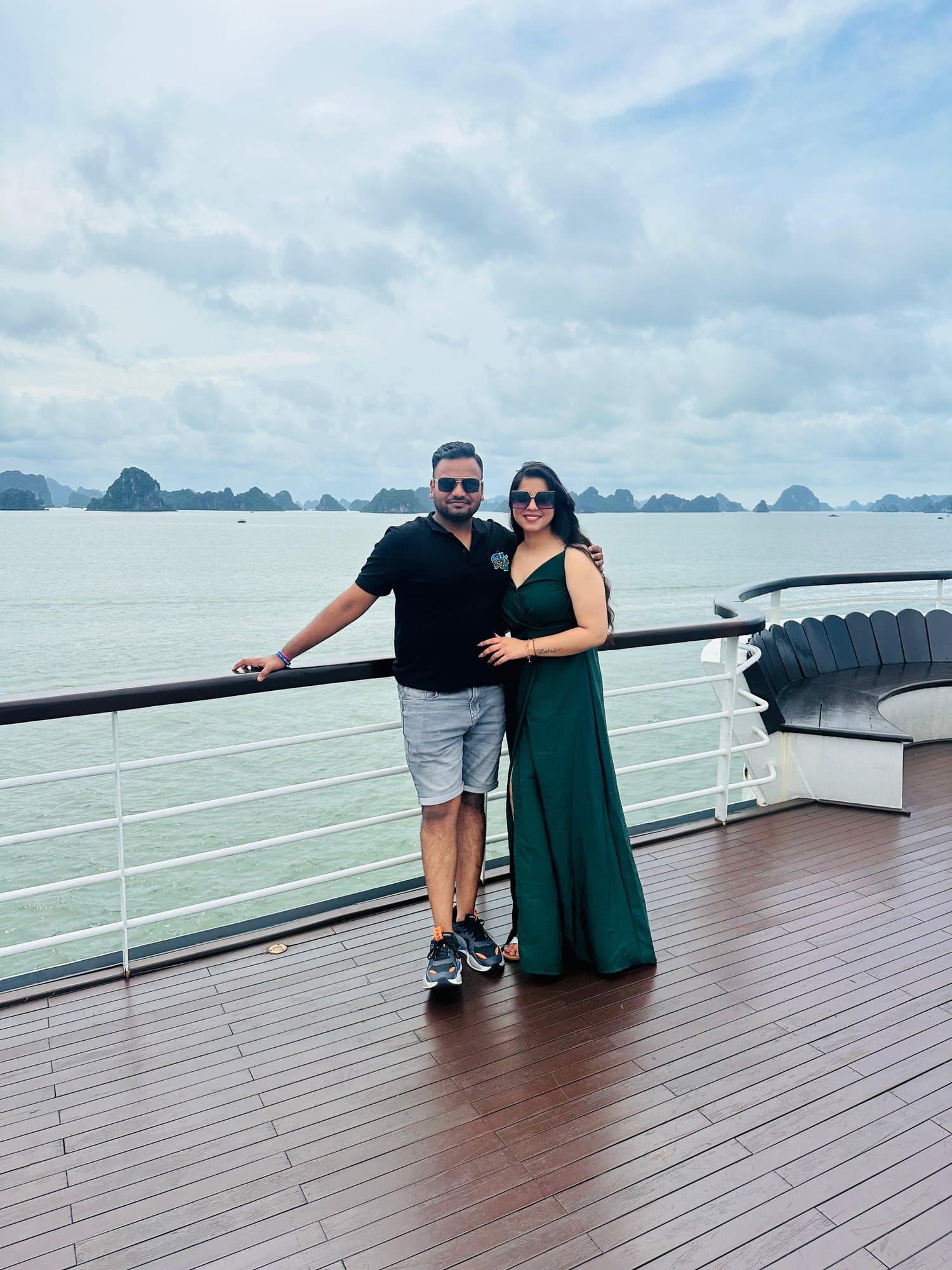 A couple on a cruise deck in Ha Long Bay