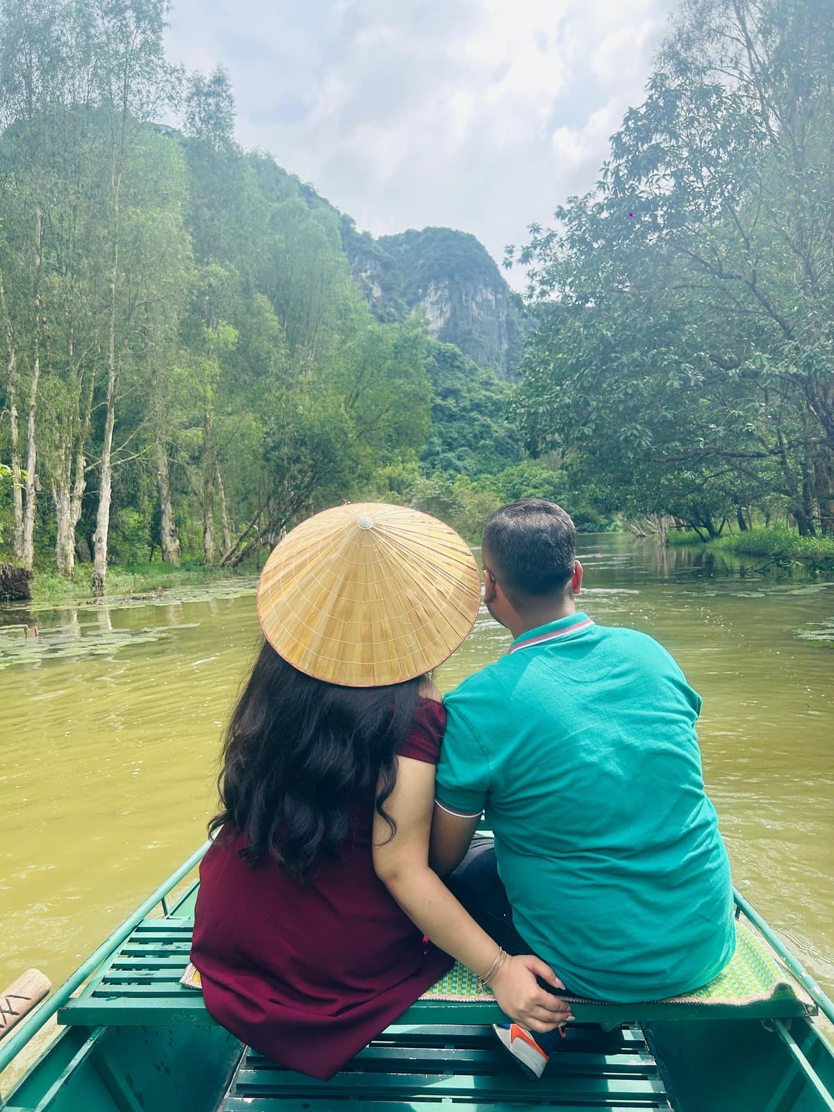 A couple on a rowing boat in Ninh Binh, Vietnam