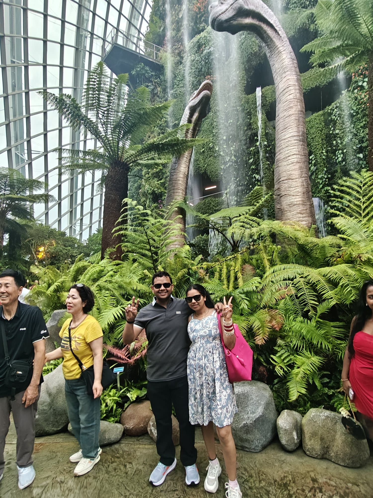 Friends by the dinosaur in the Cloud Forest, Gardens by the Bay