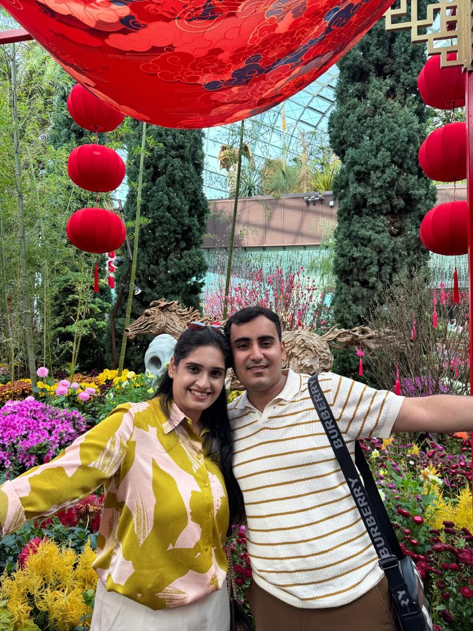 A couple among red lanterns in the Flower Dome, Gardens by the Bay