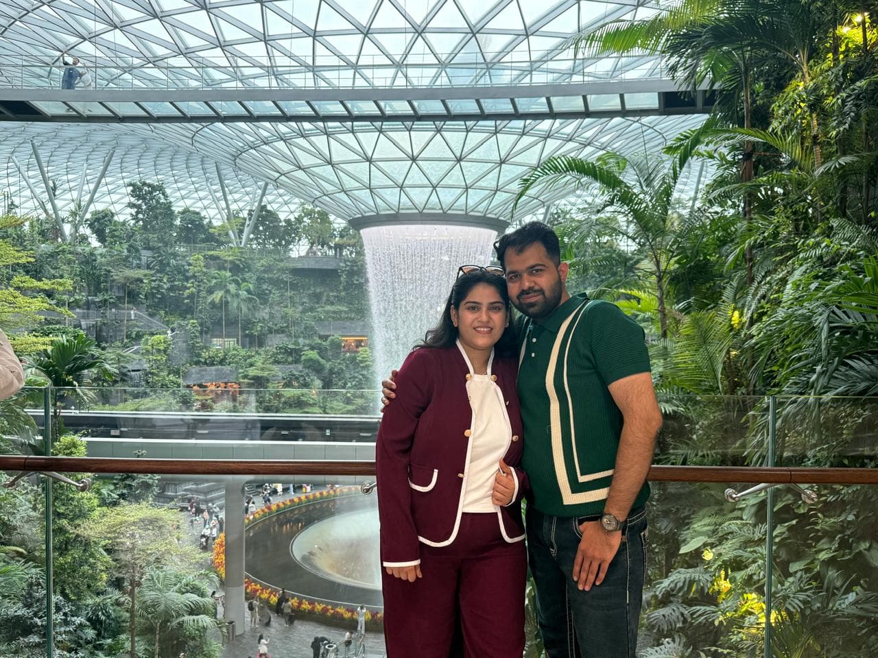 A couple by the Rain Vortex at Jewel Changi