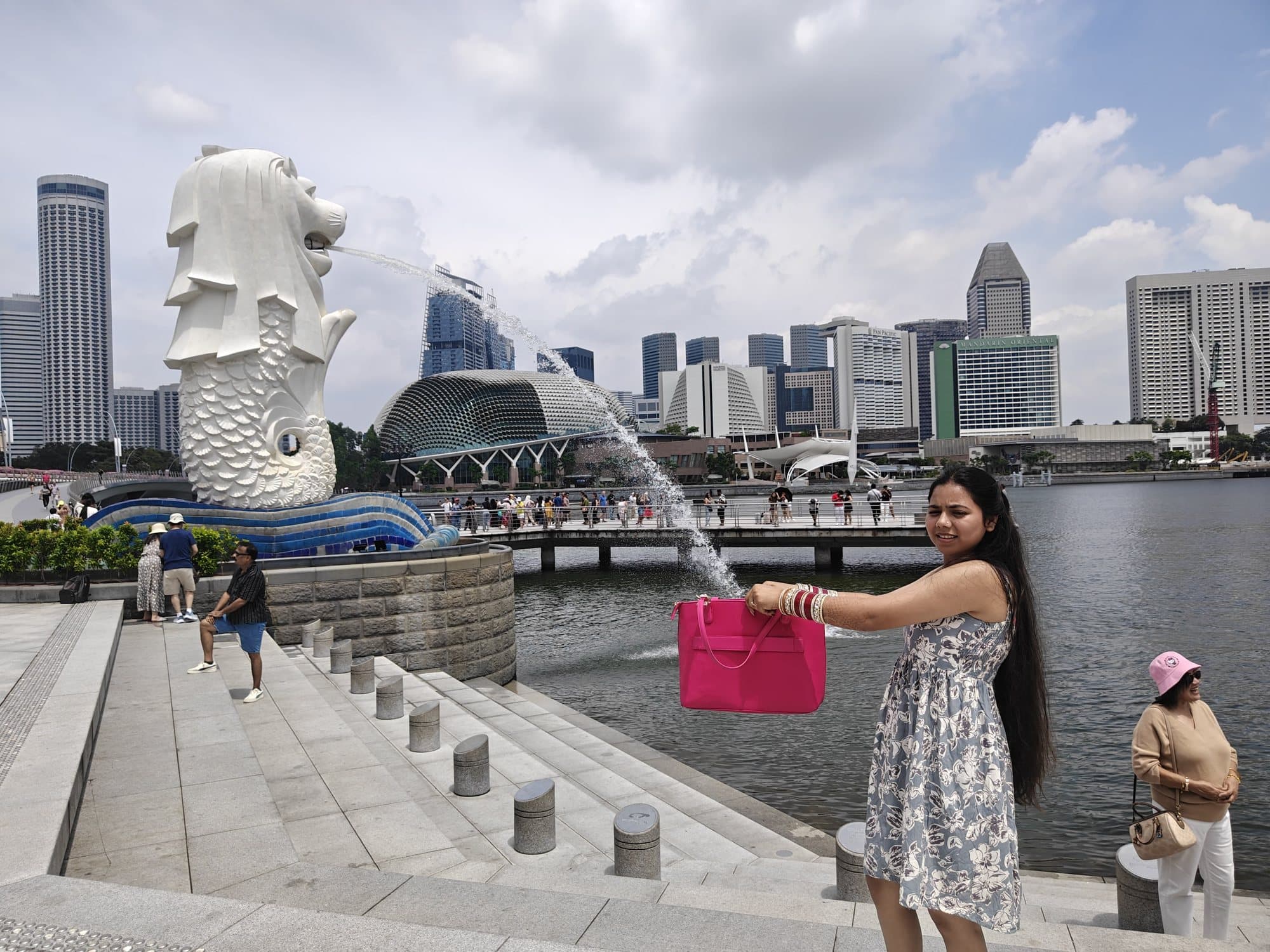 Posing by the Merlion, Marina Bay