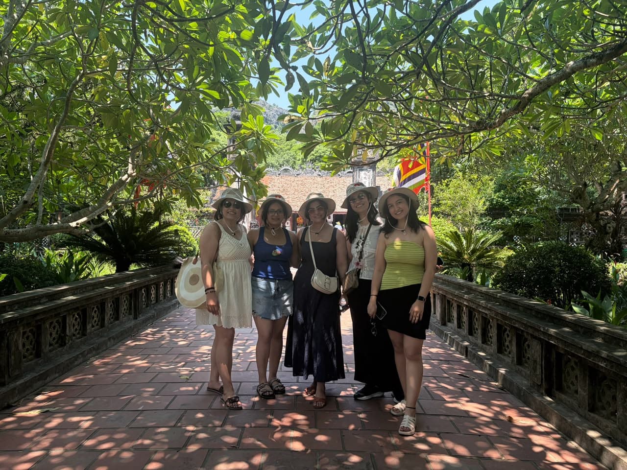 Friends on a garden bridge in Vietnam