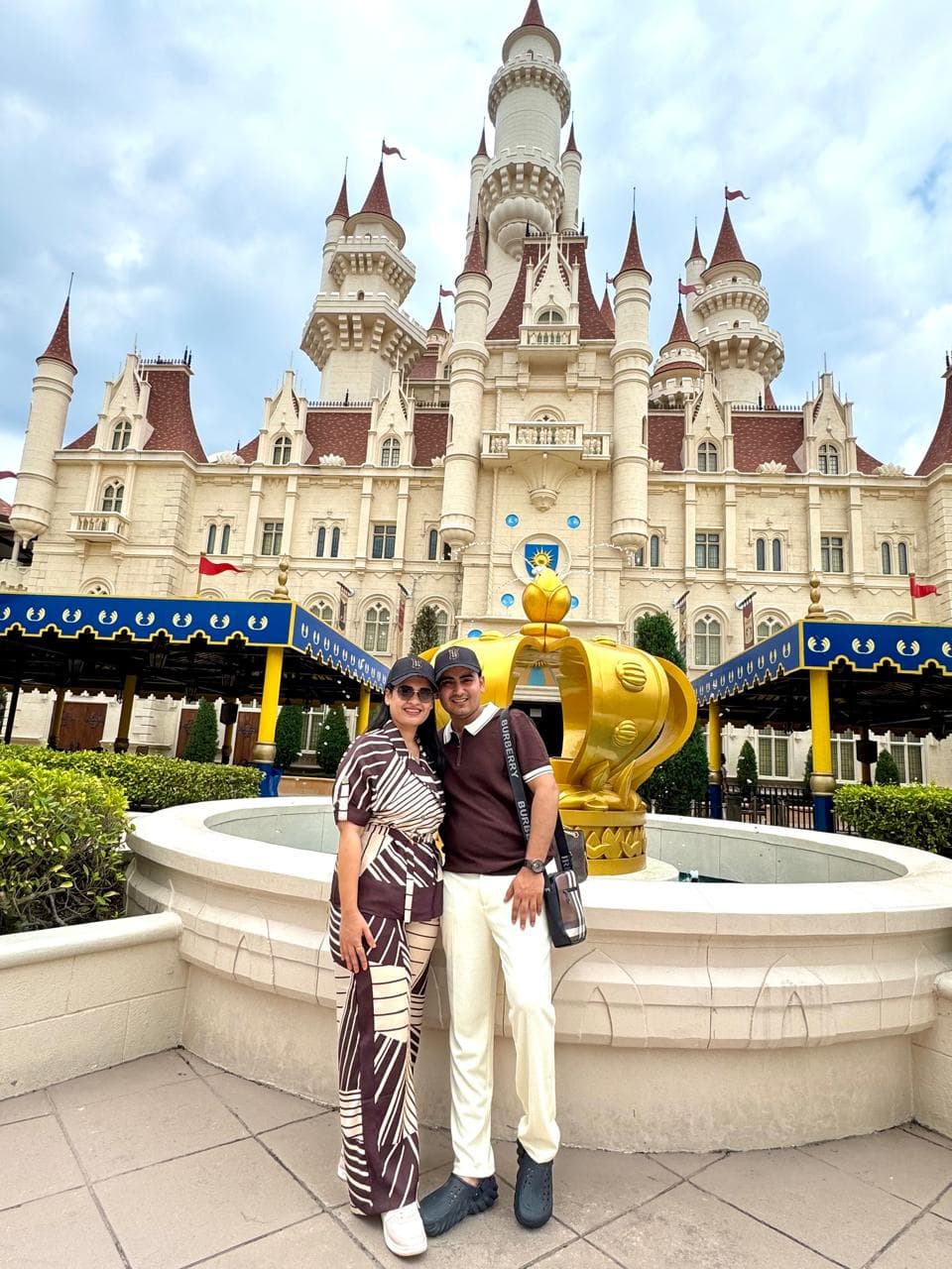 A couple outside the castle at Universal Studios Singapore