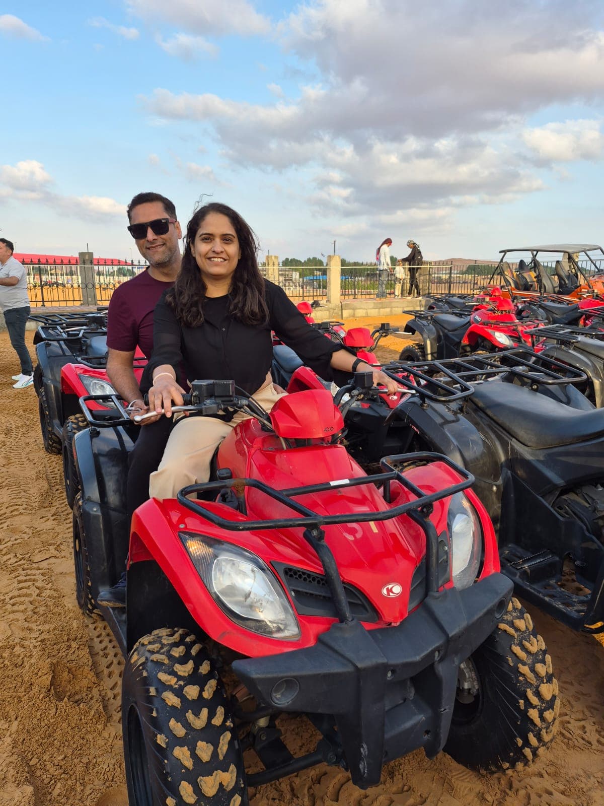Family members on quad bikes in the Dubai desert