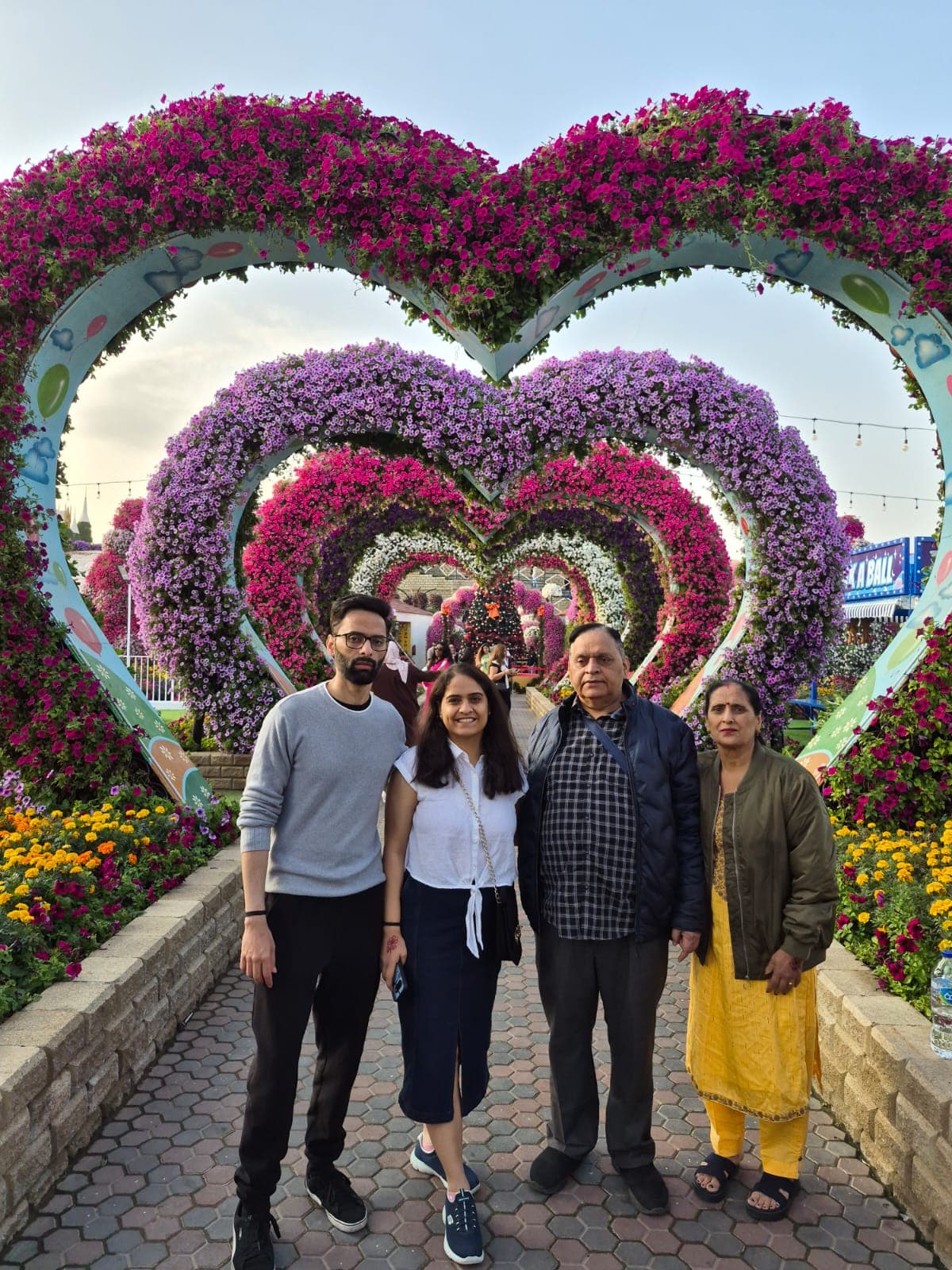 A family under the heart arches at Dubai Miracle Garden